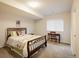 Comfortable bedroom with a double bed and study desk at 13943 W 87Th Ln, Arvada, CO 80005