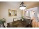 Elegant dining room with decorative mirror and view into the arched hallway at 13943 W 87Th Ln, Arvada, CO 80005