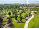 Beautifully landscaped green space with walking paths and mature trees, offering a serene retreat at 13943 W 87Th Ln, Arvada, CO 80005