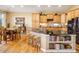 Beautiful kitchen with a large island, granite countertops, and stainless steel appliances at 13943 W 87Th Ln, Arvada, CO 80005