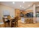 Spacious kitchen with a breakfast nook and a center island with seating at 13943 W 87Th Ln, Arvada, CO 80005