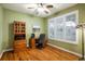 Bright office space with hardwood floors, window shutters, and built-in storage at 13943 W 87Th Ln, Arvada, CO 80005