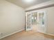 Neutral room with glass paneled french doors at 13943 W 87Th Ln, Arvada, CO 80005