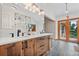 Bright bathroom featuring double sink vanity with quartz countertops and modern fixtures at 6307 S Gallup St, Littleton, CO 80120