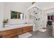 Beautiful bathroom featuring a bathtub with a sleek modern shower with glass surround at 6307 S Gallup St, Littleton, CO 80120