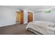 Finished basement bedroom with carpeted floors, closet, and neutral paint, offering a relaxing space at 6307 S Gallup St, Littleton, CO 80120