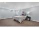 Basement bedroom with carpeted floors, natural light from windows, and neutral color scheme at 6307 S Gallup St, Littleton, CO 80120