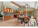 Well-appointed kitchen featuring custom wood cabinetry, hardwood floors, and ample counter space at 6307 S Gallup St, Littleton, CO 80120