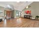 Spacious room boasts hardwood floors, a vaulted ceiling, and a stylish front entry at 6307 S Gallup St, Littleton, CO 80120