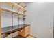 Office featuring a built-in desk with storage and shelving at 6307 S Gallup St, Littleton, CO 80120