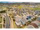 Wonderful aerial view of a meticulously planned community featuring beautiful homes, green spaces, and access to a park and elementary school at 2028 Trail Stone Ct, Castle Rock, CO 80108