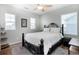 Serene bedroom featuring a comfortable bed, natural light, and minimalistic decor at 2028 Trail Stone Ct, Castle Rock, CO 80108