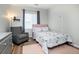 Cozy bedroom features plush chair, area rug, and a charming unicorn themed comforter at 2028 Trail Stone Ct, Castle Rock, CO 80108