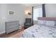 Well-lit bedroom with plush chair, soft rug, dresser, and charming unicorn themed comforter at 2028 Trail Stone Ct, Castle Rock, CO 80108