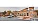 Beautifully designed clubhouse featuring a stone facade, covered walkway, and convenient parking with accessible spaces at 2028 Trail Stone Ct, Castle Rock, CO 80108