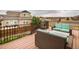 Relaxing outdoor deck with comfortable wicker seating and wrought iron railing at 2028 Trail Stone Ct, Castle Rock, CO 80108