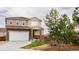 Beautiful two-story home with an attached garage and a well-manicured lawn at 2028 Trail Stone Ct, Castle Rock, CO 80108
