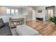 Bright and spacious living room with wood floors and modern furnishings at 2028 Trail Stone Ct, Castle Rock, CO 80108