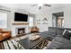 Spacious living room with fireplace and comfortable seating at 2028 Trail Stone Ct, Castle Rock, CO 80108