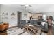 Bright open living room features modern furnishings and seamless flow to kitchen at 2028 Trail Stone Ct, Castle Rock, CO 80108