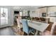 Spacious open-concept home with a view of the kitchen, dining area, and living room, enhanced by natural light at 2028 Trail Stone Ct, Castle Rock, CO 80108