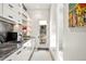 Bright hallway featuring marble counters, cabinetry, and a view to the outdoors at 42 S Ash St, Denver, CO 80246