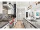 Modern kitchen features high-end appliances, custom cabinetry, and a spacious layout perfect for cooking at 42 S Ash St, Denver, CO 80246