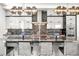 Gourmet kitchen featuring marble countertops, a stylish backsplash, and designer lighting fixtures at 42 S Ash St, Denver, CO 80246