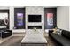 Beautiful living room featuring a modern fireplace, artistic decor, and comfortable seating at 42 S Ash St, Denver, CO 80246