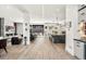 Open-concept living space seamlessly connecting the living room and kitchen with sleek modern design at 42 S Ash St, Denver, CO 80246