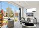 Relaxing sitting room with a wall of windows, plush chairs, and stylish decor at 42 S Ash St, Denver, CO 80246