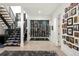 View of the modern home wine cellar with black trim staircase, concrete floor, and Gathering photos at 42 S Ash St, Denver, CO 80246