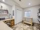 Spacious basement with tile flooring, built-in desk, and storage shelving at 14310 Kalamath St, Westminster, CO 80023