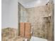 Bathroom featuring tiled walls, glass shower door, and modern fixtures at 14310 Kalamath St, Westminster, CO 80023