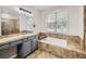 Bathroom features granite countertops, vanity, and bathtub at 14310 Kalamath St, Westminster, CO 80023