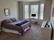 Bright bedroom featuring a bay window, desk, and calming neutral walls at 14310 Kalamath St, Westminster, CO 80023
