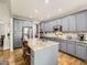 Bright kitchen with stainless steel appliances and grey cabinetry at 14310 Kalamath St, Westminster, CO 80023