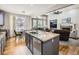 Open-concept kitchen with granite countertops connected to living room at 14310 Kalamath St, Westminster, CO 80023