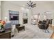 Spacious living room featuring fireplace, built-in cabinet, and carpeting at 14310 Kalamath St, Westminster, CO 80023