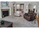 Inviting living room with fireplace, creating a comfortable atmosphere for gatherings and relaxation at 14310 Kalamath St, Westminster, CO 80023