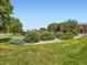Community playground surrounded by lush green grass and trees in a well-maintained area at 14310 Kalamath St, Westminster, CO 80023