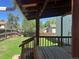 A covered back porch overlooks the home's spacious fenced-in backyard at 17477 E Temple Dr, Aurora, CO 80015