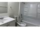 Clean bathroom with white fixtures, including a tub and vanity at 17477 E Temple Dr, Aurora, CO 80015