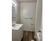 Bright bathroom featuring a white vanity, updated fixtures, and a shower with white tiling at 17477 E Temple Dr, Aurora, CO 80015