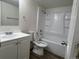 Clean bathroom with white fixtures, including a tub and vanity at 17477 E Temple Dr, Aurora, CO 80015
