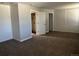 Large bedroom with closets, doorway to bathroom, and a bright window at 17477 E Temple Dr, Aurora, CO 80015