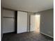 Spacious bedroom featuring a closet and a view into the adjoining bathroom at 17477 E Temple Dr, Aurora, CO 80015