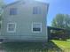 Exterior view of the home and backyard, showing a covered porch at 17477 E Temple Dr, Aurora, CO 80015