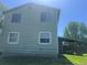 Exterior view of the home and backyard, showing a covered porch at 17477 E Temple Dr, Aurora, CO 80015