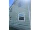 A side view of the home, showcasing its exterior at 17477 E Temple Dr, Aurora, CO 80015